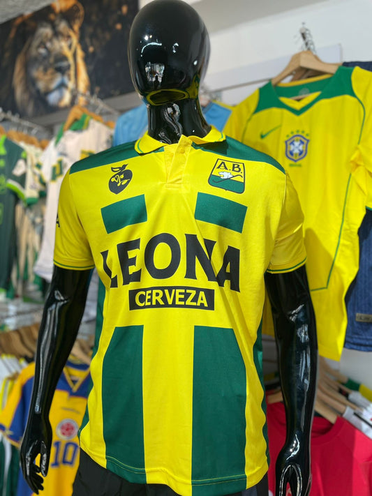 🐆 Camiseta Retro Atlético Bucaramanga “Cerveza Leona” – Edición Clásica 💛💚